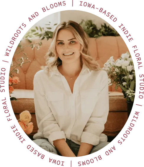 Nikia, founder of Wildroots + Blooms, framed by the words “Wildroots and Blooms | Iowa-based indie floral studio”